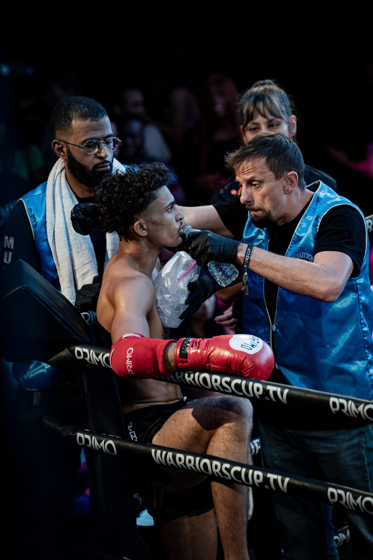 The corner working on a fighter between rounds