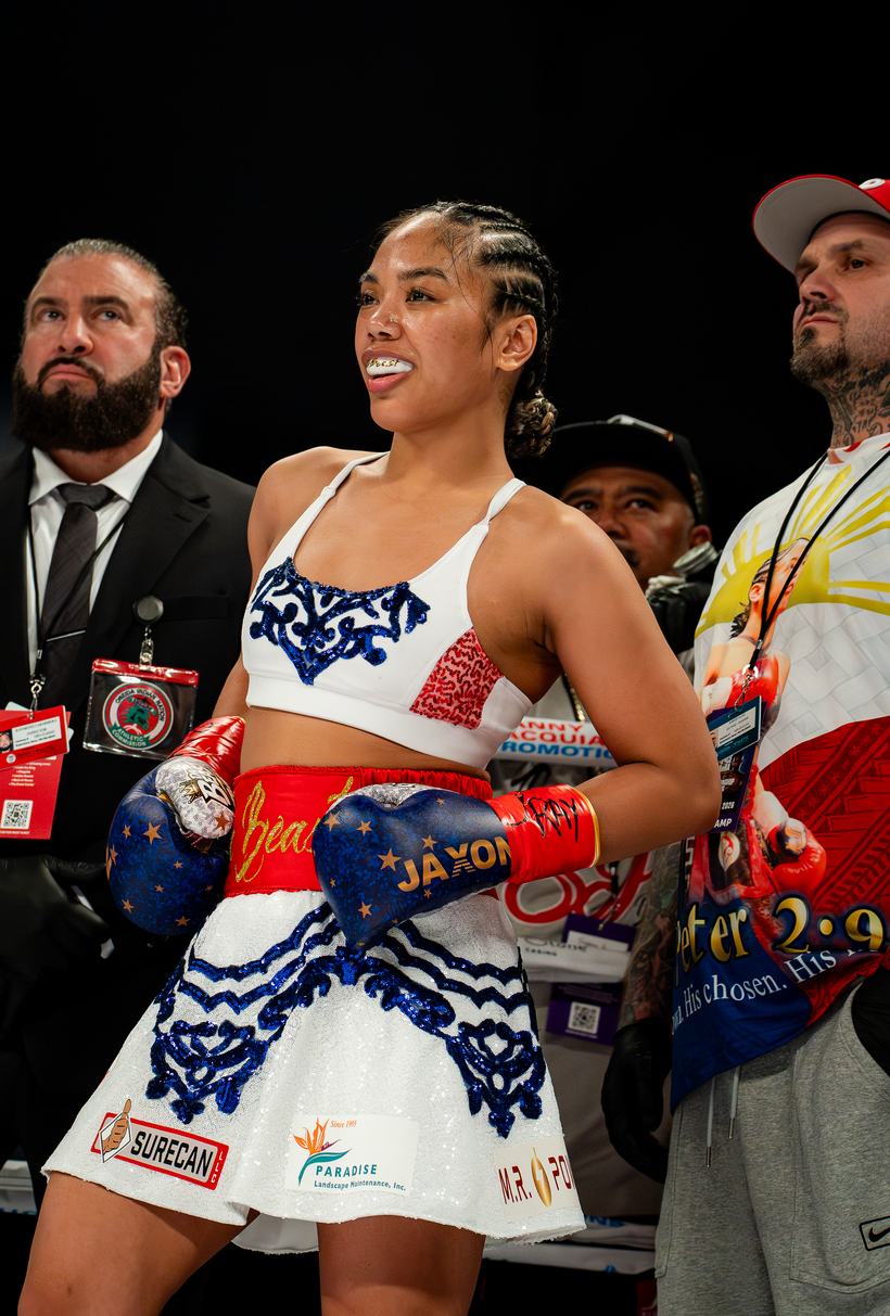 Boxer entering the ring in stars and stripes trunks