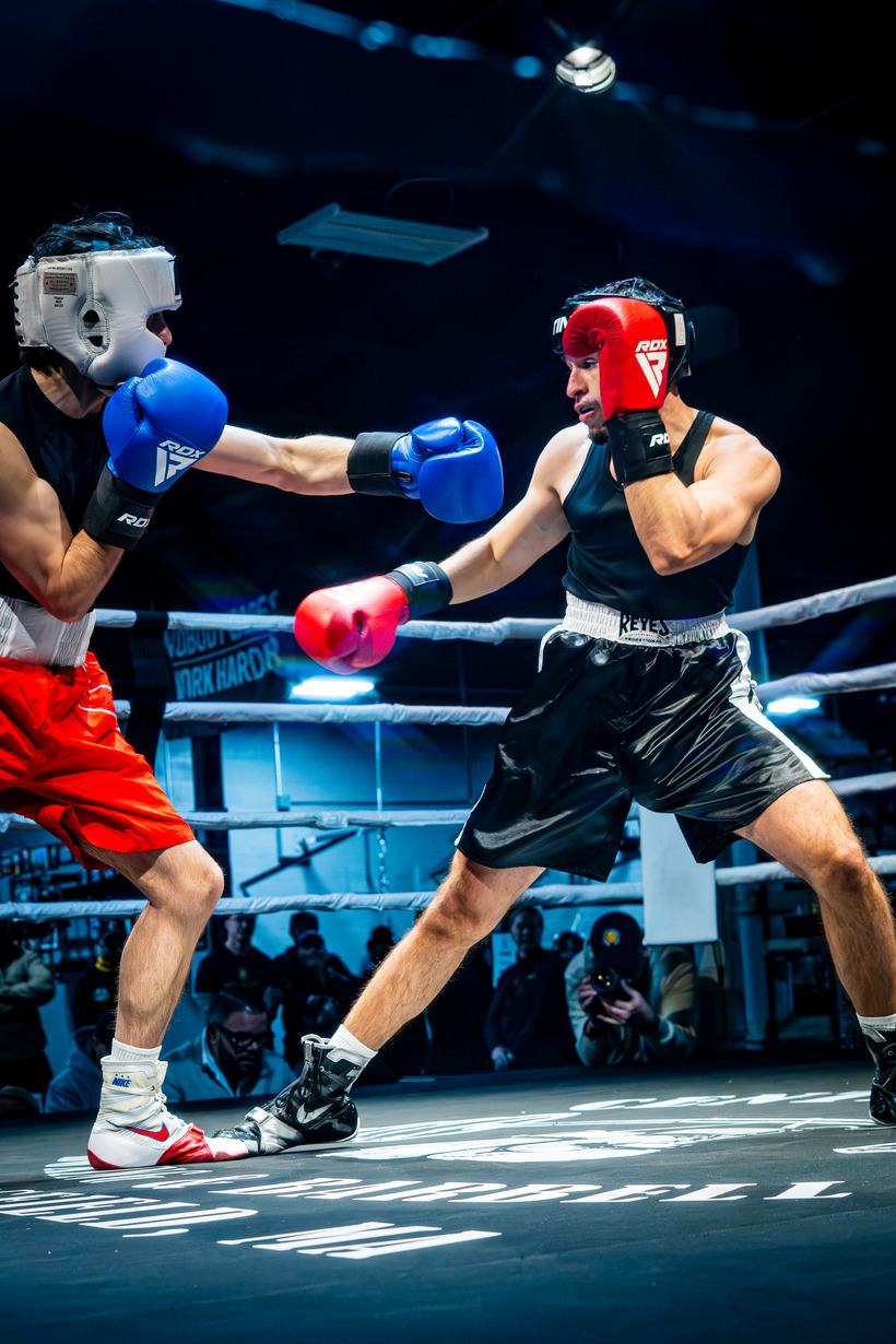 Straight punch landing in an amateur boxing bout
