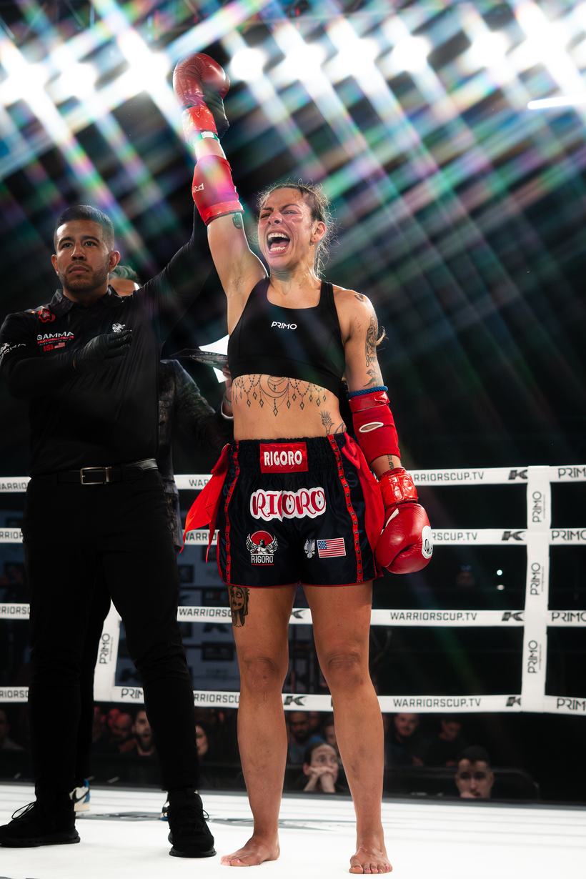Fighter shouting with an arm raised after the decision