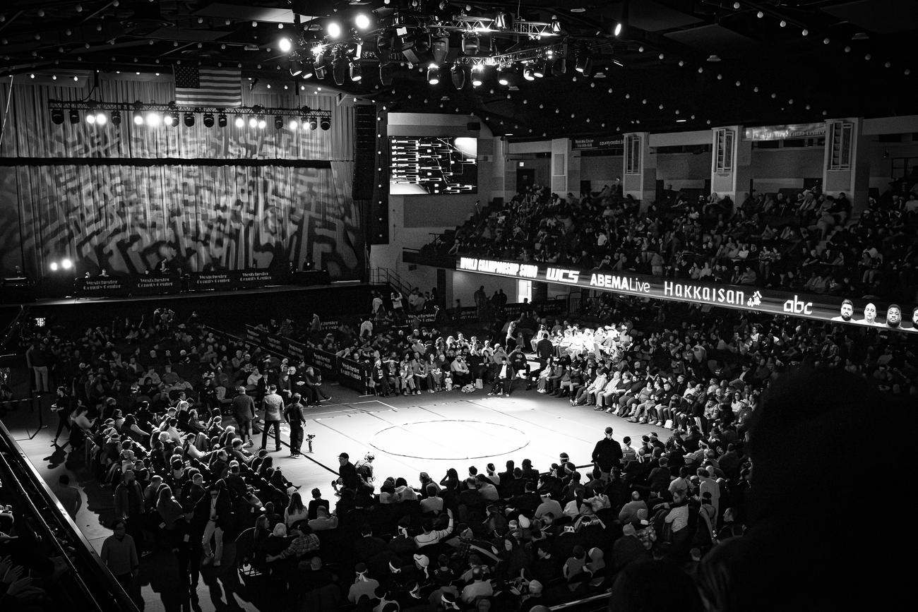 The arena from the upper deck, crowd filling the floor