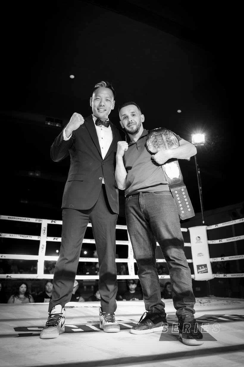 Announcer beside the champion and his belt