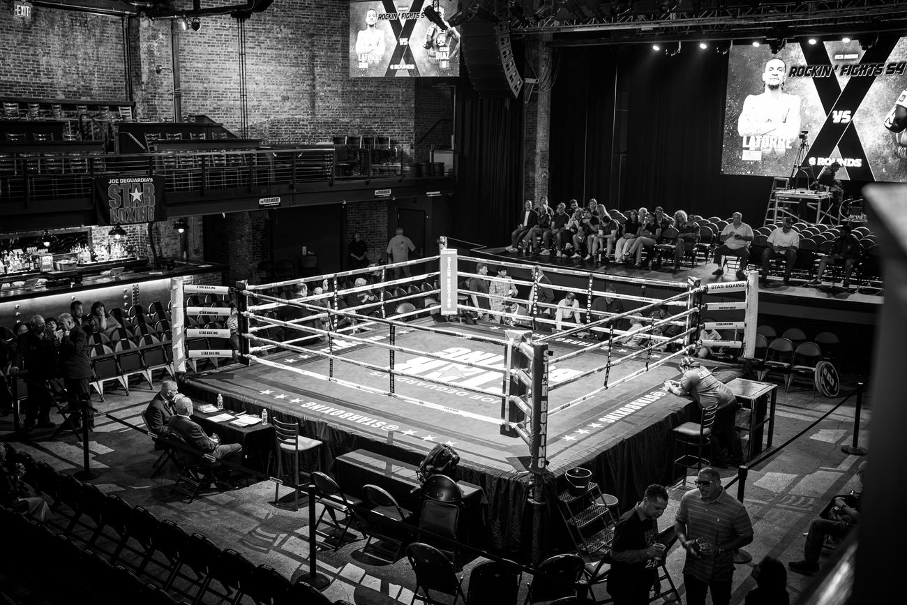 The room seen from the balcony, ring lit at the centre
