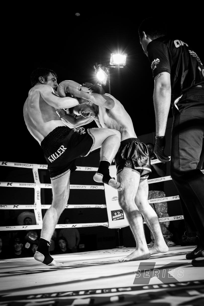 Knee strike landing in a Muay Thai clinch