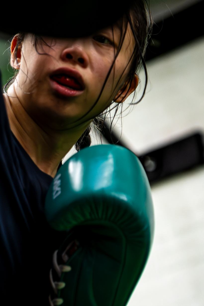 Fighter throwing a glove straight at the camera