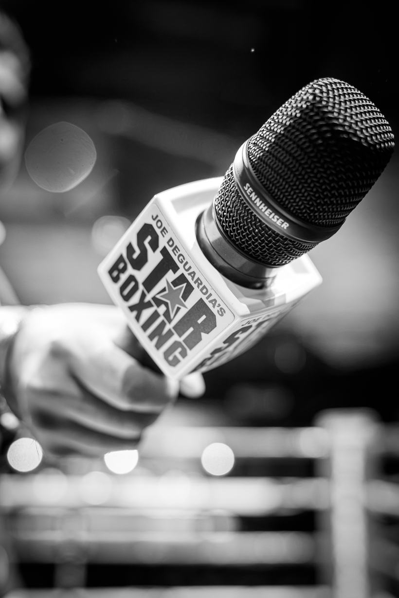 Broadcast microphone resting on the ring apron