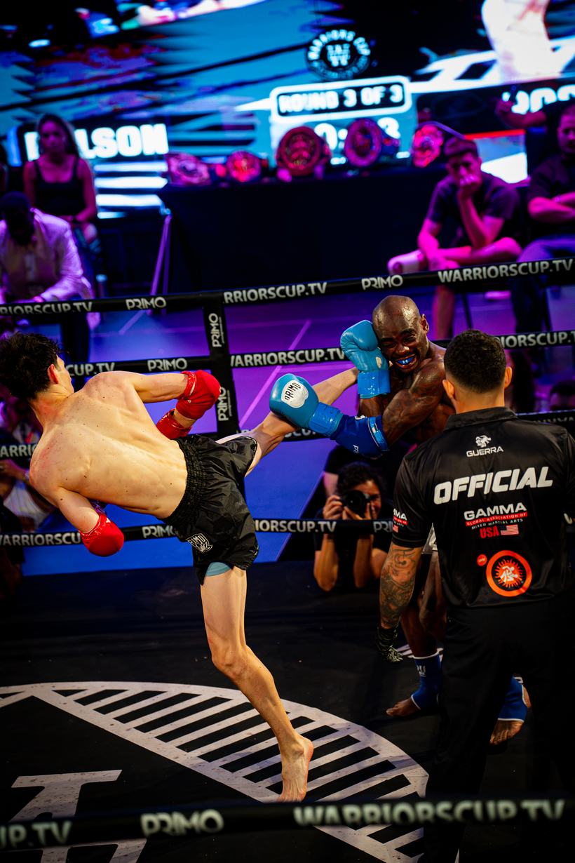 Flying knee thrown across the ring