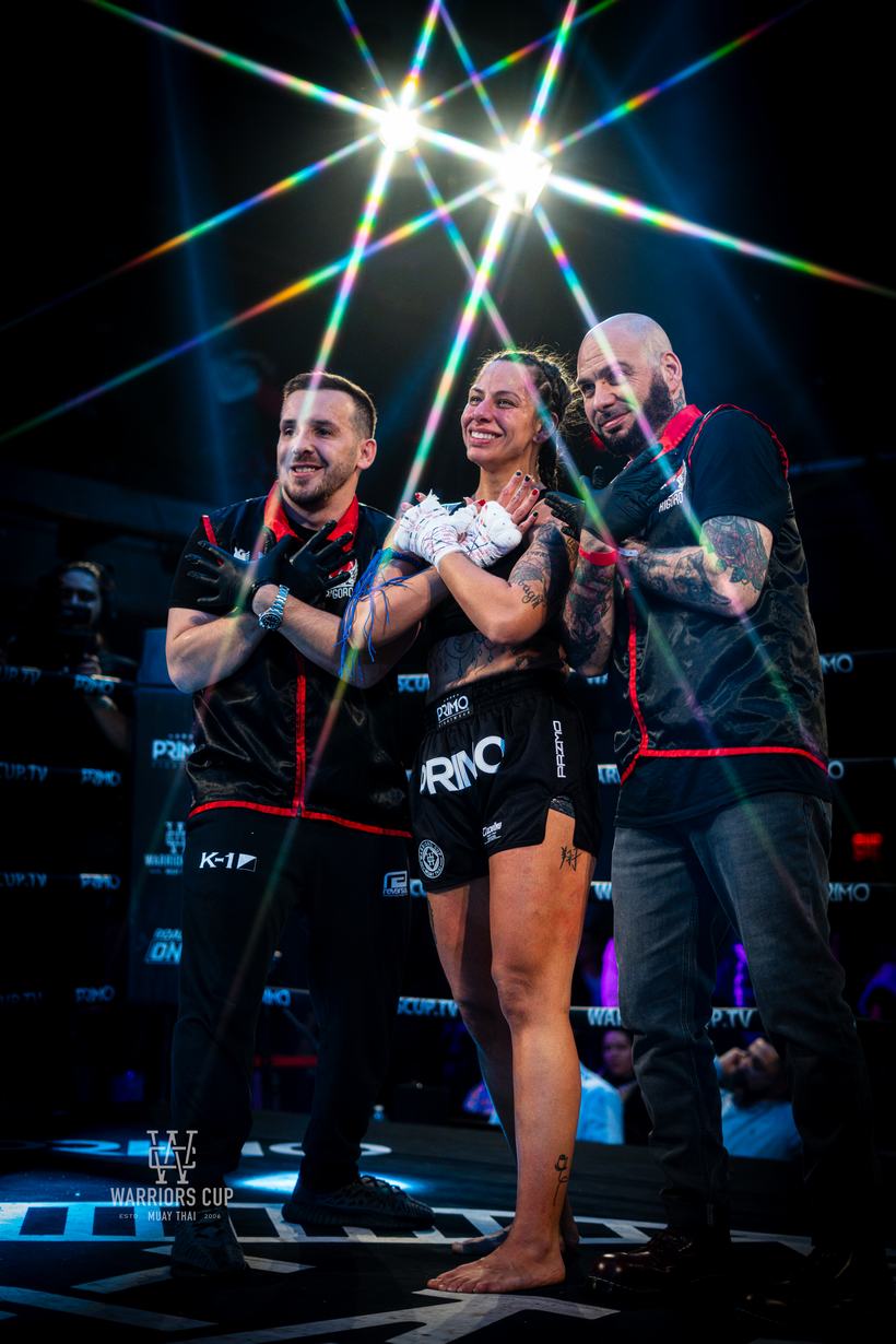 Fighter held by two cornermen between rounds