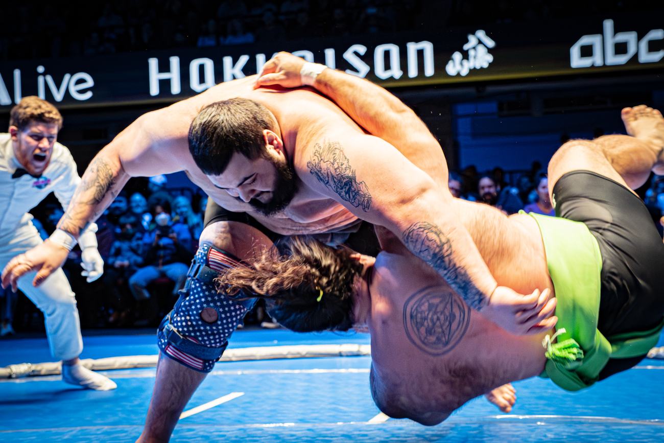 Wrestler driven off his feet and out of the circle
