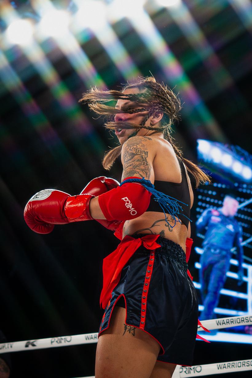 Fighter turning through a strike, hair flying