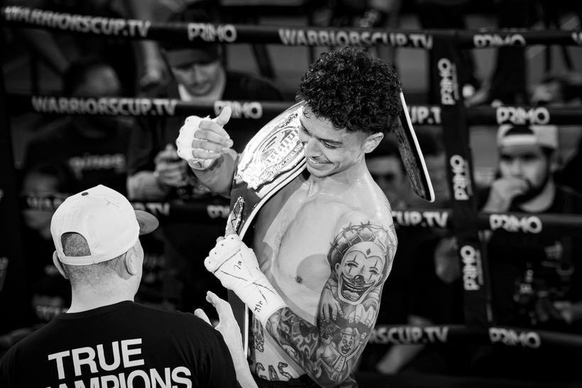 Title belt being fastened around the winner