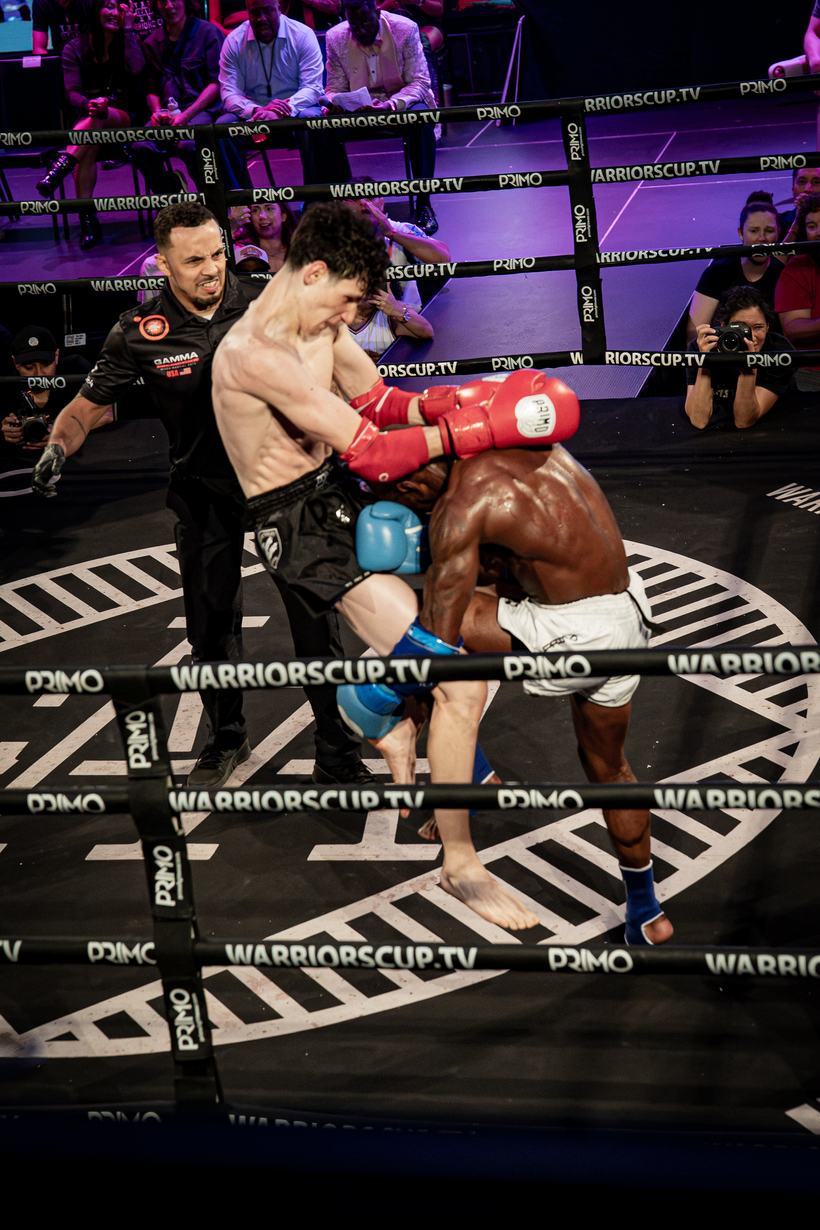 Body kick landing clean against the ropes