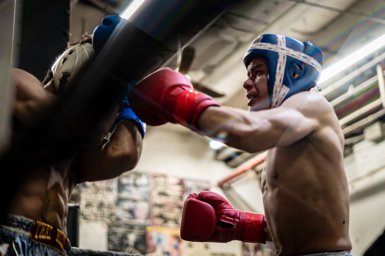 Sparring in the gym, punch landing on the guard